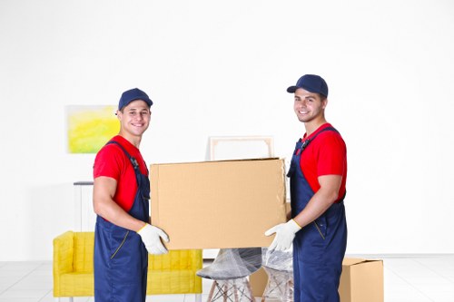 Removal team preparing safely with packing materials and lift planning