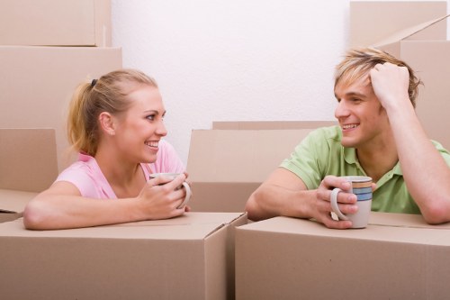 Professional movers carrying furniture during a same day move in Temple
