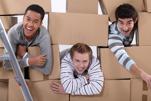 Professional flat removals in Temple with movers handling boxes and furniture
